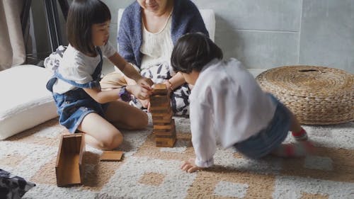 A Family Playing Jenga