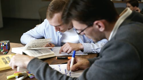 Men Taking Notes