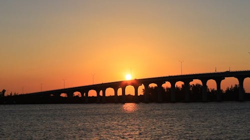 Calm River Waters and Bridge at Golden Hour