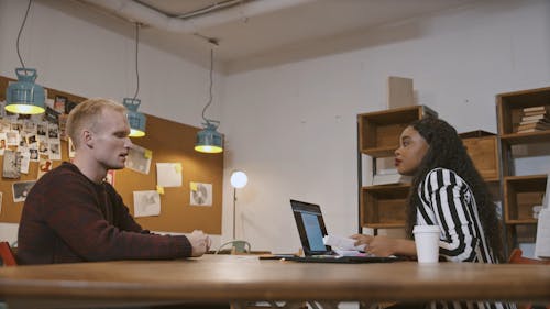 Young Man and Woman Checking Paperwork