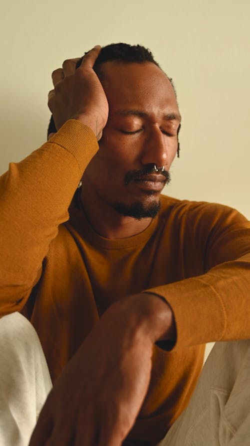 Man Quietly Sitting and Thinking