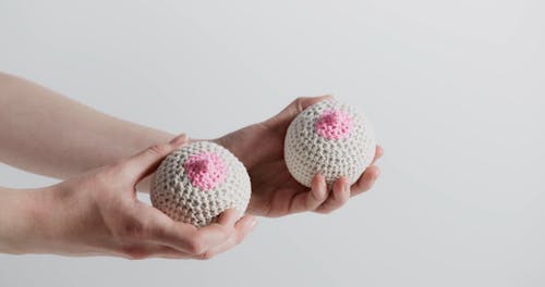 Person Holding a Knitted Ball with Breast design