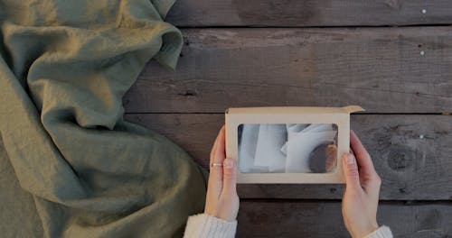 Flatlay Opening a Oranges Sweets Box 