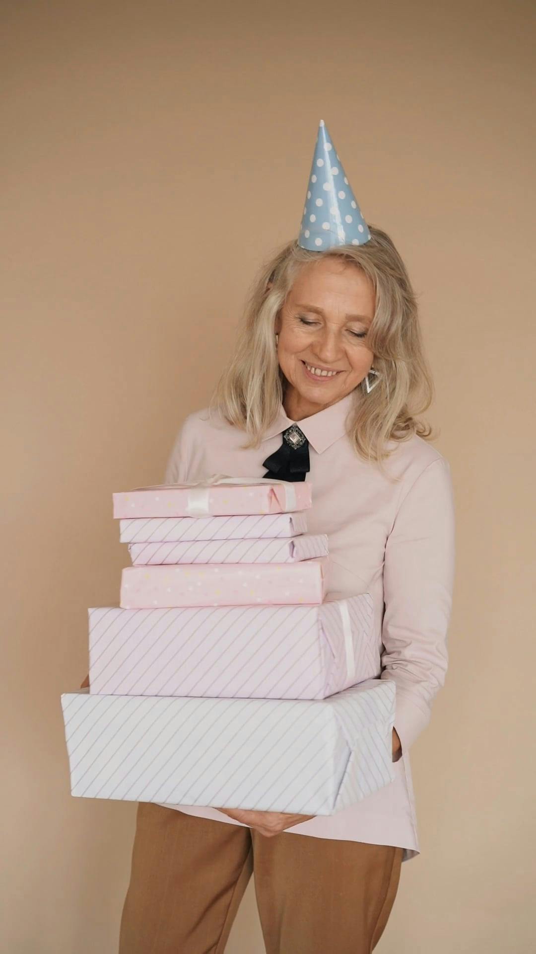 Elderly Woman Holding Birthday Gifts \u00b7 Free Stock Video