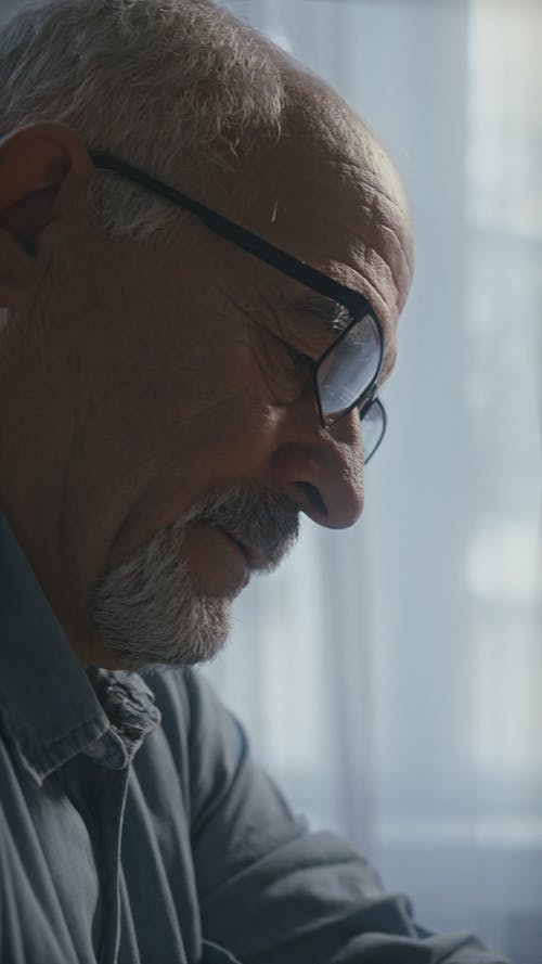 Close-Up View of a Man Wearing Eyeglasses