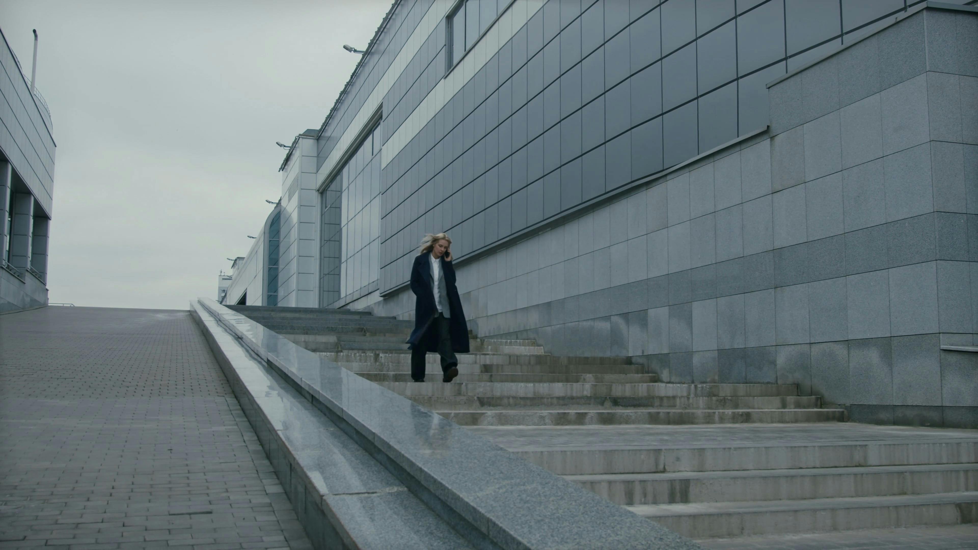 A Woman Walking Down The Stairs While On A Phone Call \u00b7 Free Stock Video