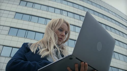 A Woman Palm Holding A Laptop 