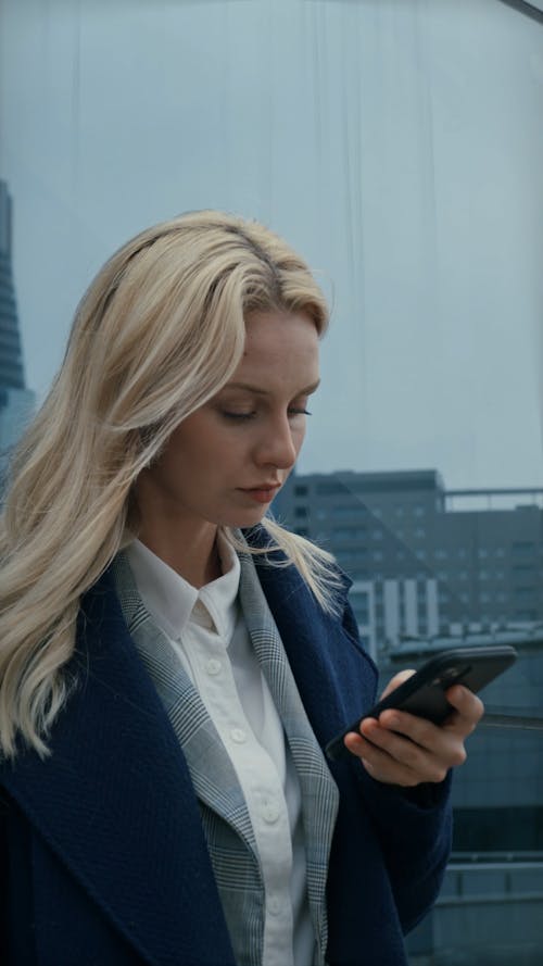 A woman Using Her Cellphone Outdoors