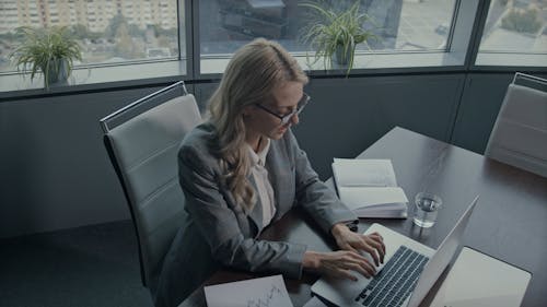 A Woman Working In Her Office