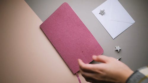 Close-Up View of Person Opening Her Diary