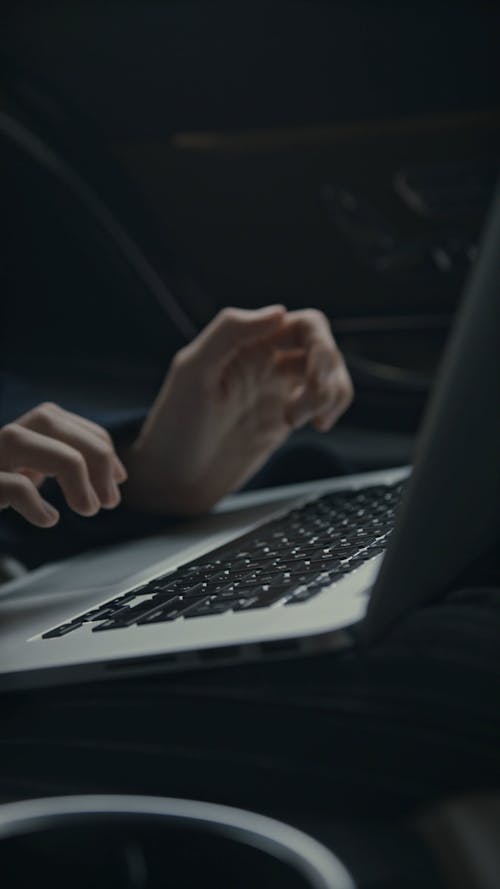 A Woman Boss Working While Inside A Car