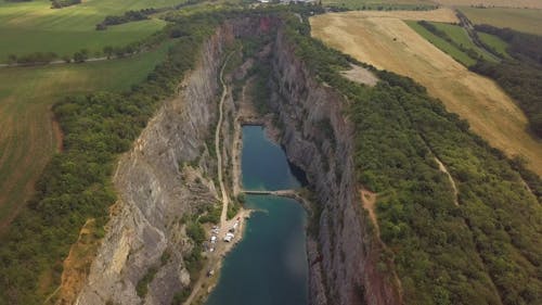 Aerial Shot of a Lake in the Middle of Two Plateaus 