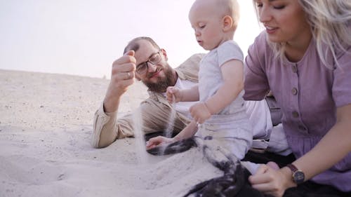 Family Playing in the Sand 