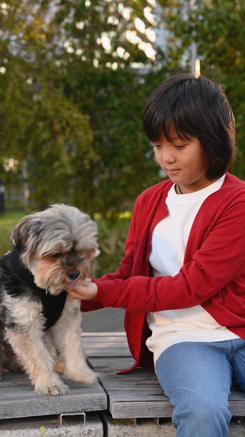 A Girl Petting Her Dog