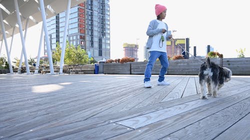 Kid Walking a Dog