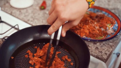 Person Frying in a Pan