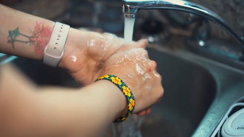 A Person Washing Hands