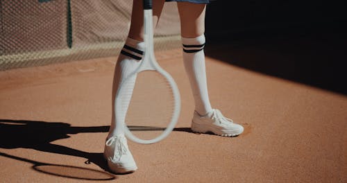 A Person Holding a Tennis Racket