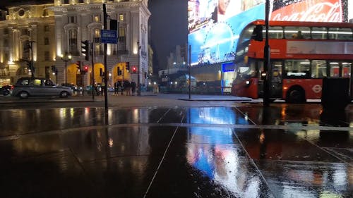 Wide Shot of a Busy London Street in a Rainy Night