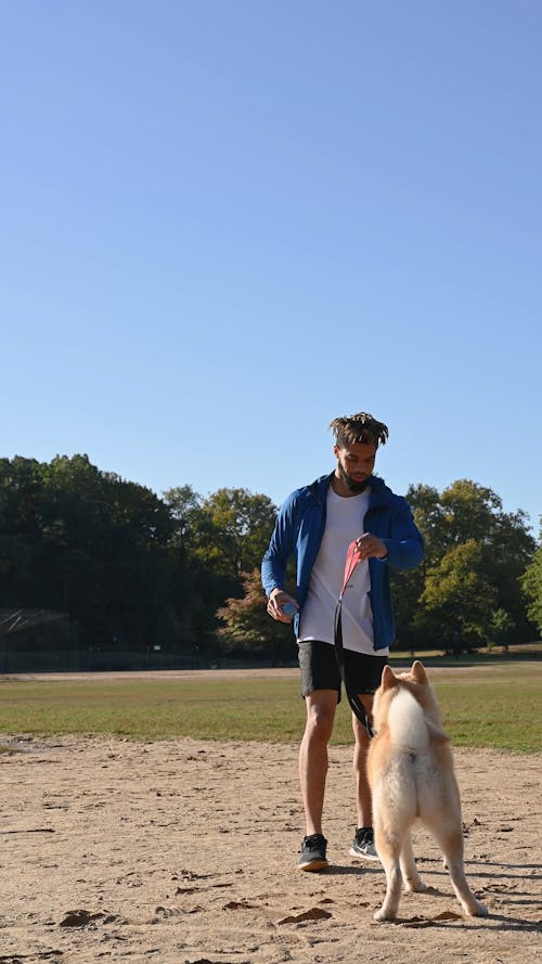 Man Playing with his Dog 