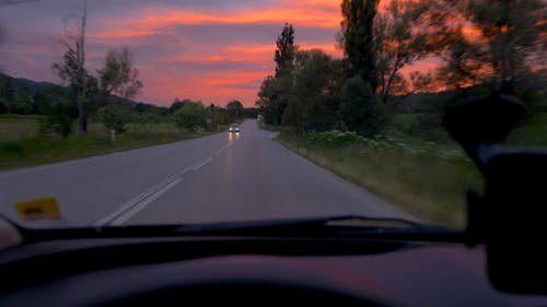 Person Driving on a Countryside Road 