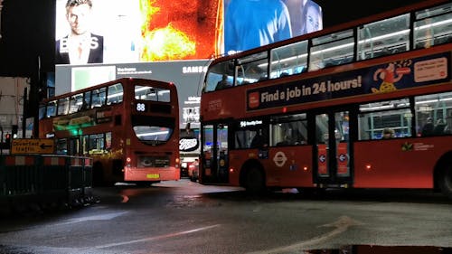 Huge Billboard Screen in Busy London Street at Night