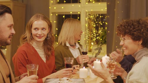 A Group Of People Having A Christmas Gathering