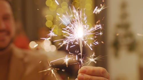 A Man Holding A Sparklers