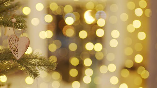 A Heart Shape Ornament Hanging In The Christmas Tree