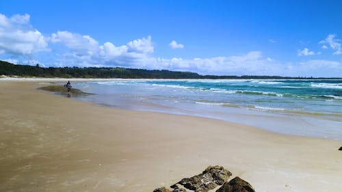 Surfer Walking on the Beach