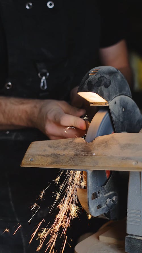 A Person Using a Grinder