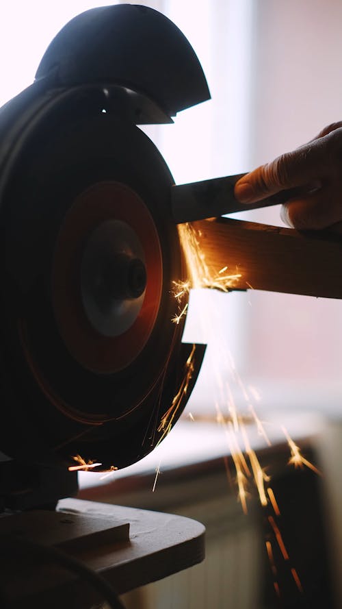 A Person Holding a Metal Bar