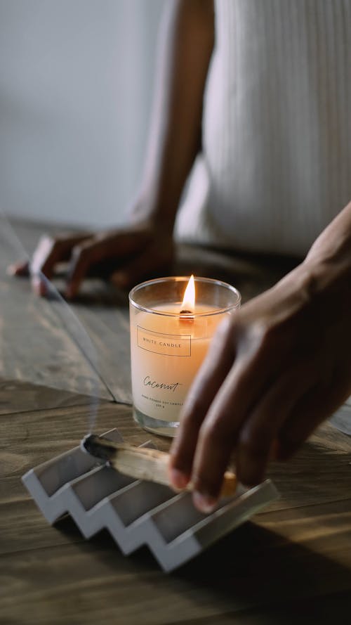 Person Holding a Palo Santo