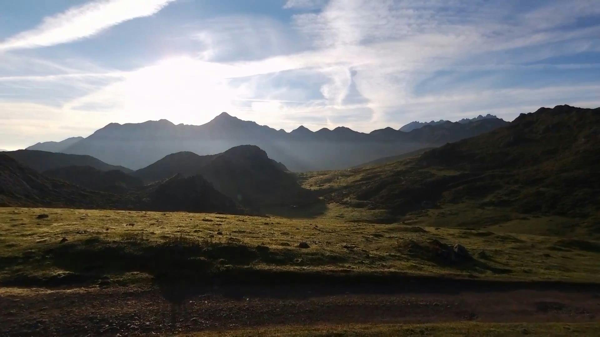 Aerial View of Green Meadows in Mountains · Free Stock Video