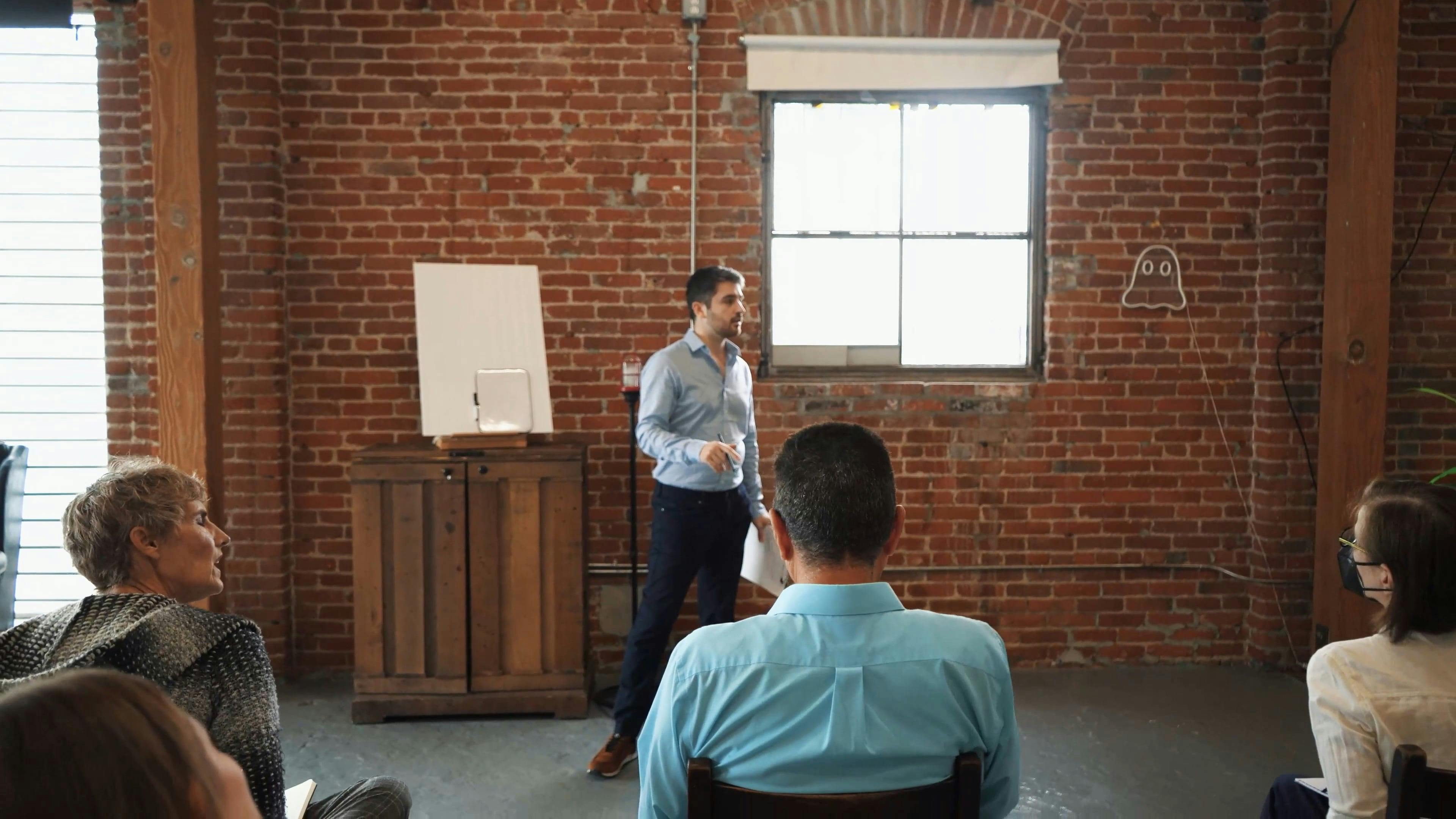 Man In Blue Dress Shirt Standing And Talking In Front Of People Free ...