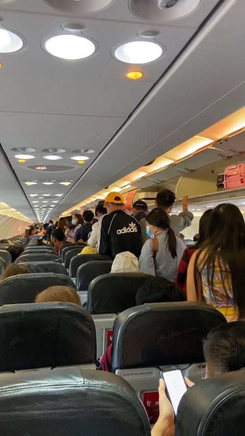 Passengers Ready to Leave an Airplane