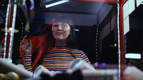 Young Cheerful Female in Amusement park