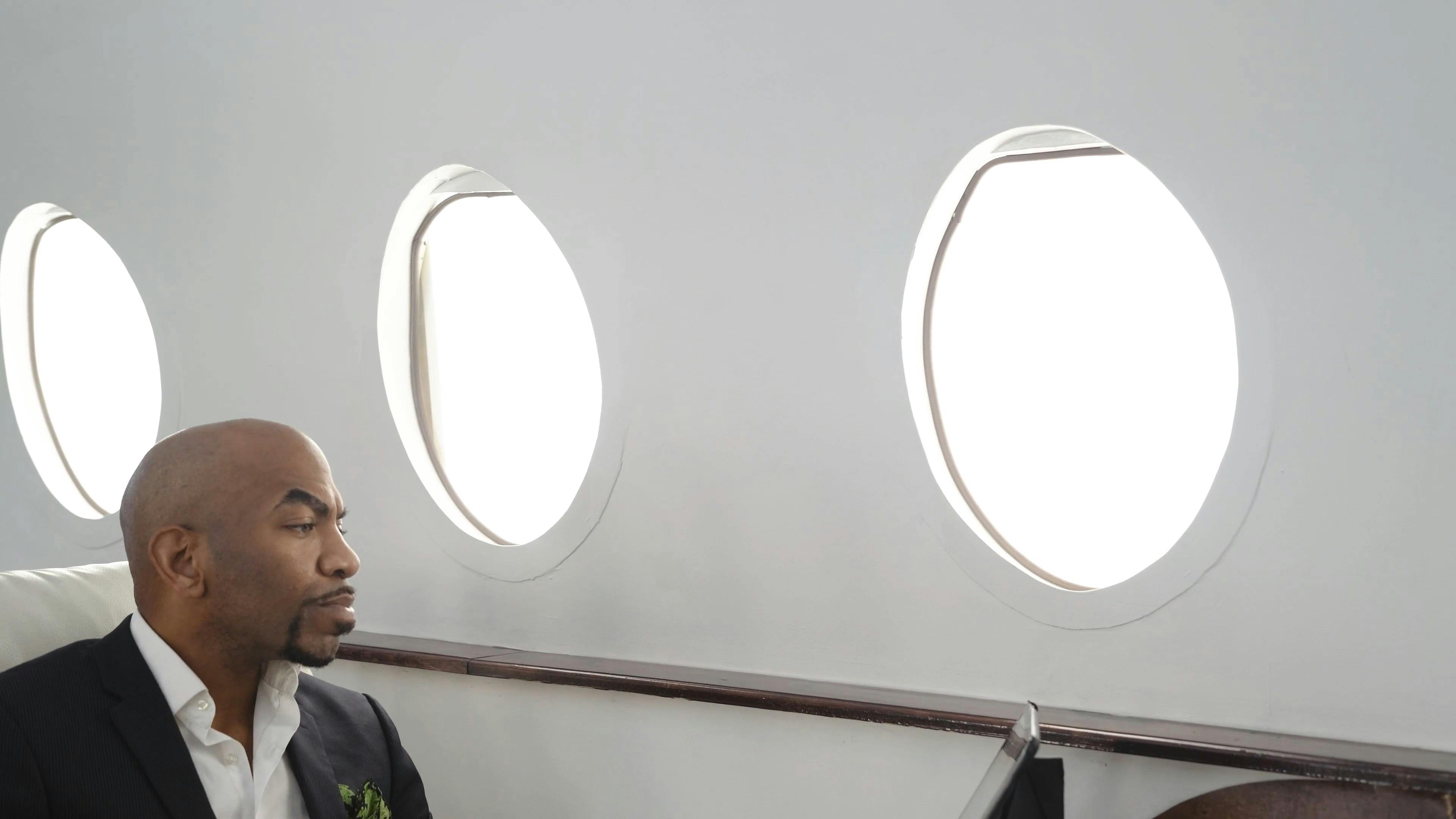 Man Using Smartphone while Travelling in Private Jet \u00b7 Free Stock Video