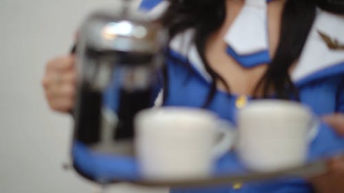 Flight Attendant serving Coffee