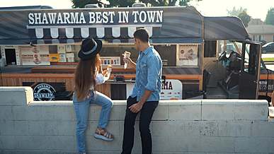 two people eating street food