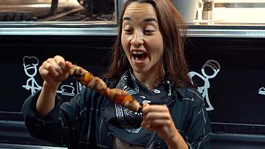 woman eating in a food truck