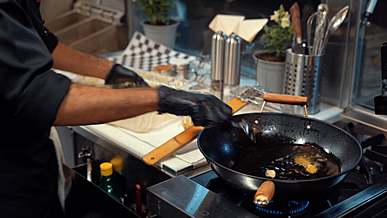 chef cooking in a food trucks kitchen