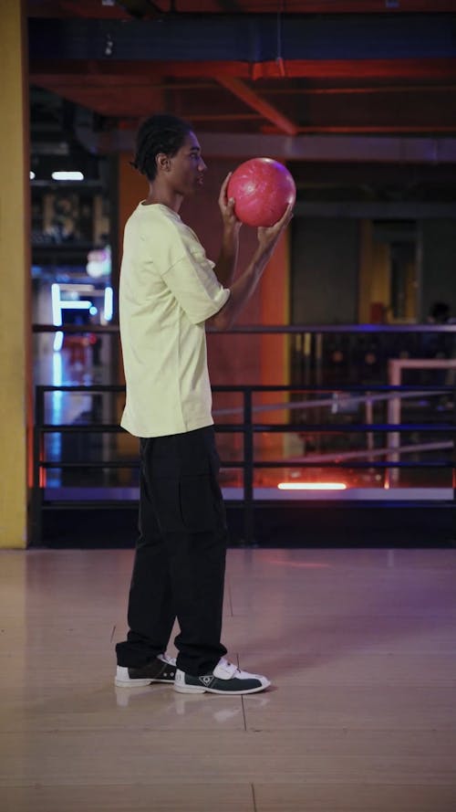 Male Teenager Playing Bowling 