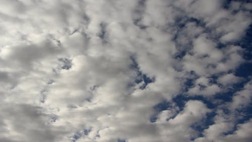 Clouds Moving Across a Blue Sky