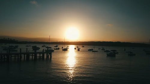 Drone View of Ships in Harbor During Golden Hour