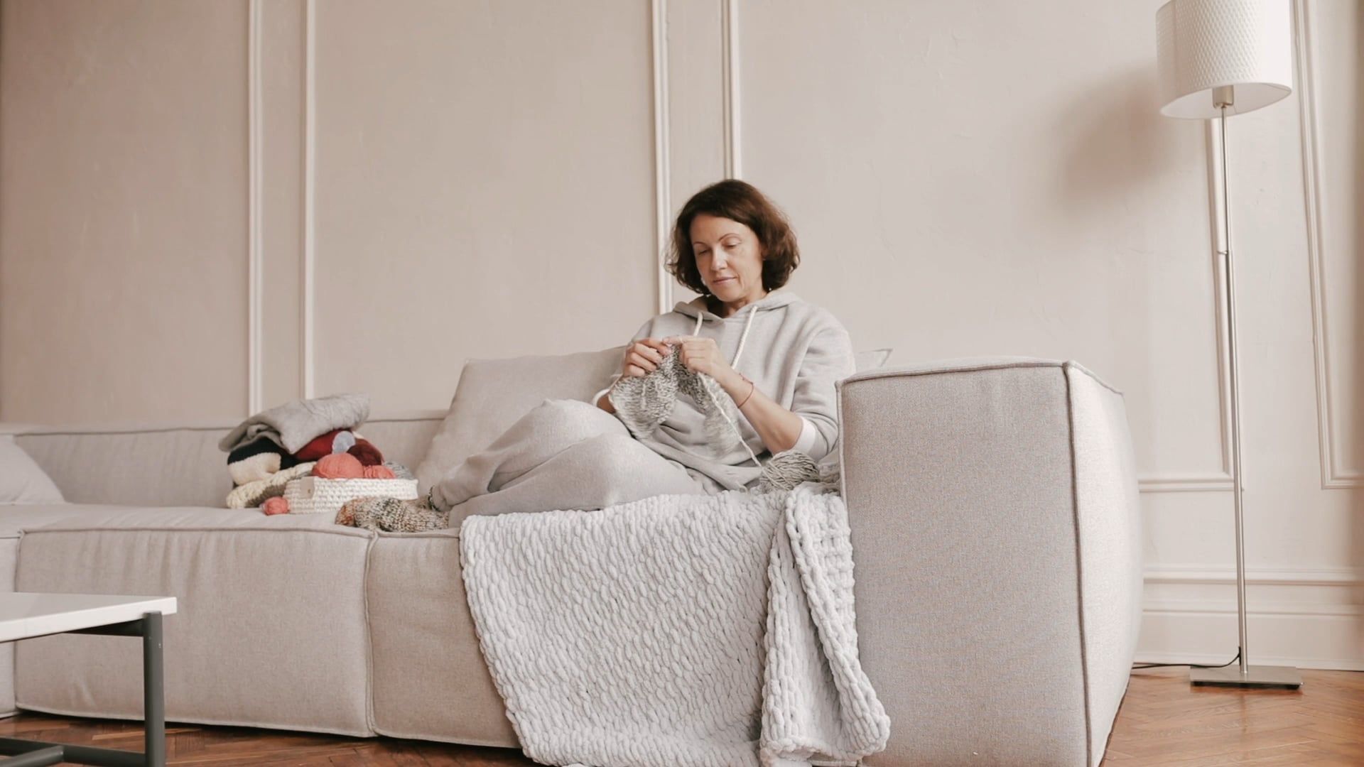 Woman Sitting on a Sofa While Knitting Free Stock Video Footage ...