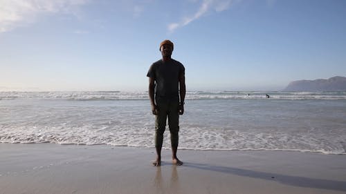 Person Standing on a Beach