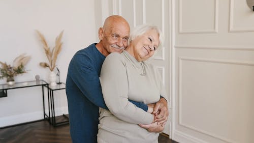 Man Hugging a Woman From Behind