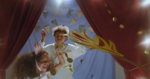 Little Girl and Boy Performing on Stage