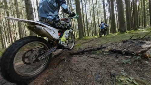 Areial Footage of Two Motorcyclists in the Woods